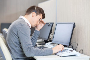 Stressed male call center operator